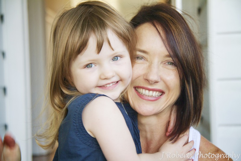 Little girl and mother smiling - family portrait photography sydney